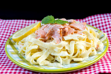 tasty pasta with salmon on a the table