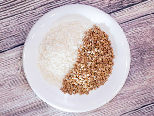 Rice and buckwheat one on a white plate
