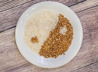 Rice and buckwheat one on a white plate