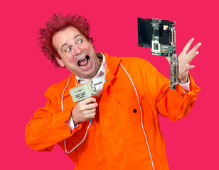 Man with solder repairs motherboard. Repairman with tools servicing the computer. Funny serviceman...