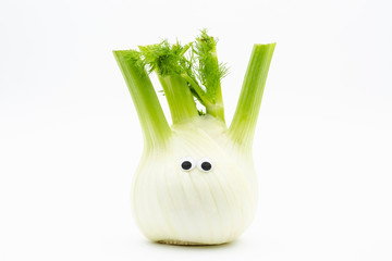 fennel with googly eyes on white background © jack1986