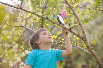 Obraz premium Happy kid enjoying sunny late summer and autumn day in nature on green grass