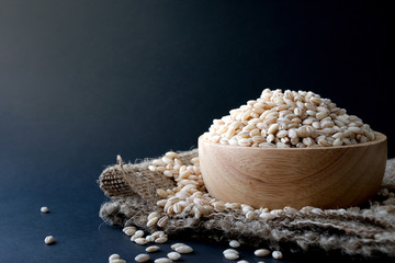 pearls barley grain seed on background.