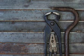 Set of various equipment, instruments and tools for manual work with copy space, carpenter tool old rusty metal background.