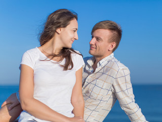 Fototapeta premium Young man and young woman talking outdoors