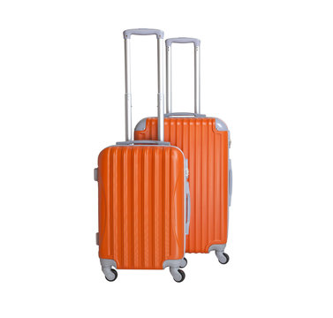 Two suitcases isolated on white background. Polycarbonate suitcases isolated on white. Orange suitcases.