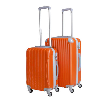 Two suitcases isolated on white background. Polycarbonate suitcases isolated on white. Orange suitcases.