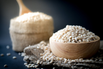 pearls barley grain seed on background.