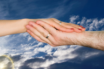 Hands of lovers, men and women in the sky. Romantic art image for cards