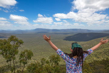 Obraz na płótnie Canvas Woman enjoying her freedom with open arms, Australia 