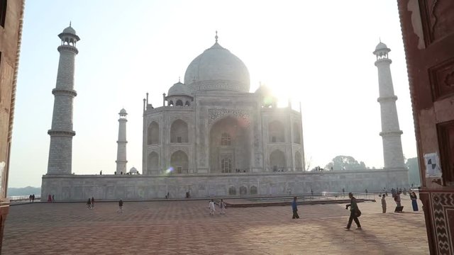 Taj Mahal front view from entrance with wooden doors.