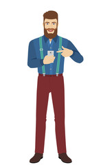 Hipster pointing at a mobile phone in his hand