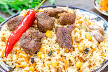 National Uzbek dish pilaf with meat and red pepper
