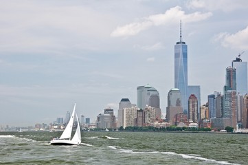 Sailing boat at Hudson river, Manhattan skyscrapers on the background, New York