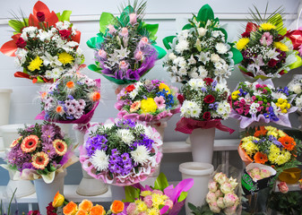 bunches of big fresh orange pink red gerbera chamomile rose and big white yellow blue chrysanthemum flower