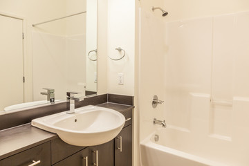 small space modern white bathroom with overhanging sink