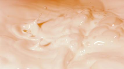 Photo of liquid milk consistency in orange color