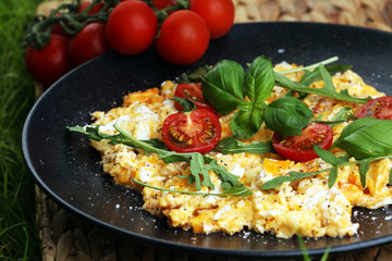 Traditional breakfast - fried eggs,ruccola, tommato- - diet concept scrambled eggs
