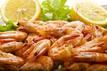 Group of fresh raw shrimp with lemon slice