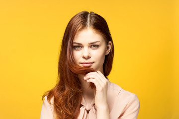 red hair yellow background Light clothing