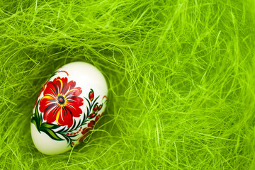 Easter egg on green like grass background