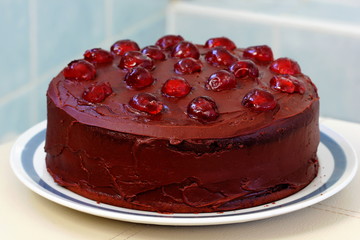 Chocolate cake with glace cherries.