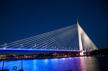 Fototapeta na wymiar Abstract image - Suspension Bridge night lights. Dusk Skyline