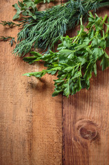 Spicy herb marjoram on a wooden table