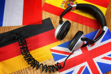 course language headphone and flag on a table