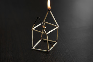 close up burned matchstick house
