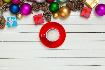cup of coffee and beautiful christmas decorations on the wonderful white wooden background