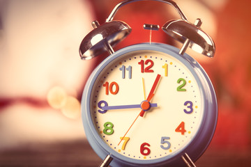 photo of colorful alarm clock on the wonderful presents background