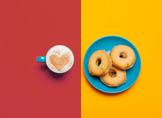 photo of cup of coffee and cookies on the wonderful  colorful background in pop art style