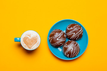photo of cup of coffee and cookies on the wonderful orange background