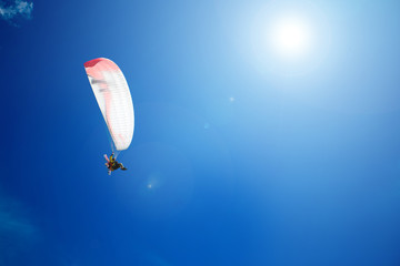 Paraplane in the blue sky
