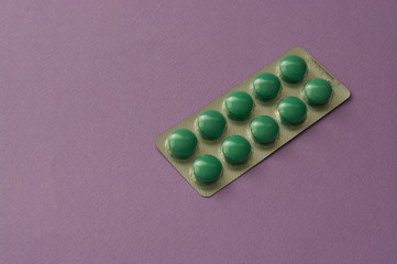 Packs of pills isolated on pink background