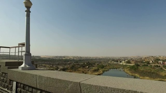 Driving across bridge to Aswan High Dam, Egypt