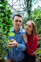 young couple in botanical garden