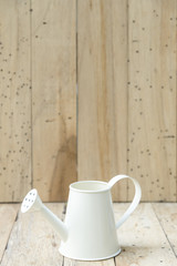 bucket of water on wood background, vintage filtered Images