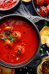 Tomato soup with baked tomatoes, top view