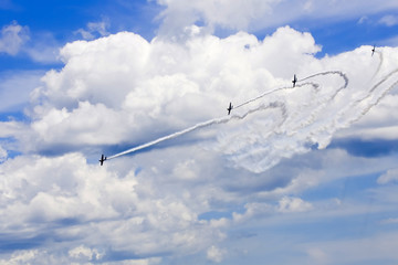 Several planes performing in an air show at Jones Beach