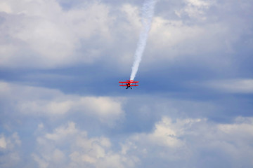 Naklejka na ściany i meble A plane performing in an air show
