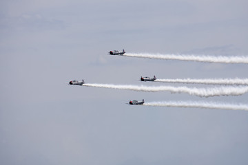 Several planes performing in an air show at Jones Beach