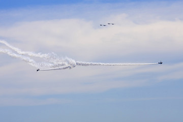 Several planes performing in an air show at Jones Beach