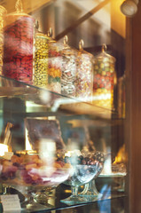 Rich variety of chocolates and candies in display window  of italian pastry shop