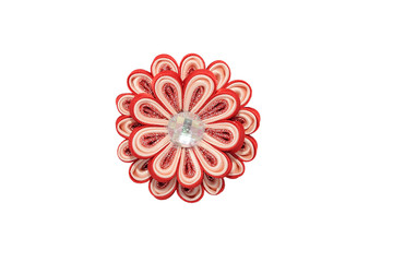 Kanzashi. Red artificial flower with brocade isolated on white b