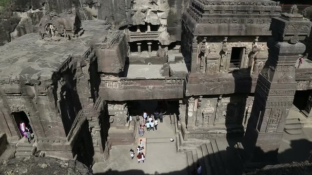 Aerial view on tourists walking through Aurangabad caves.