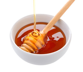 Honey in bowl on white background