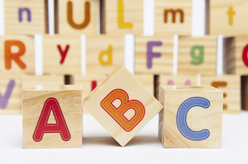 Spelling blocks toys with ABC in the foreground