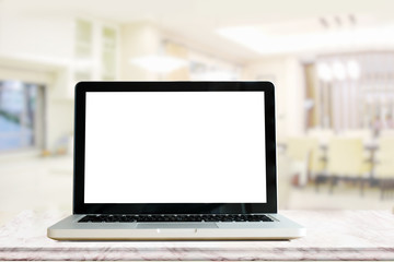 Fototapeta premium Blank screen Laptop on pink Marble top table in kitchen room. For product or Graphic display montage.